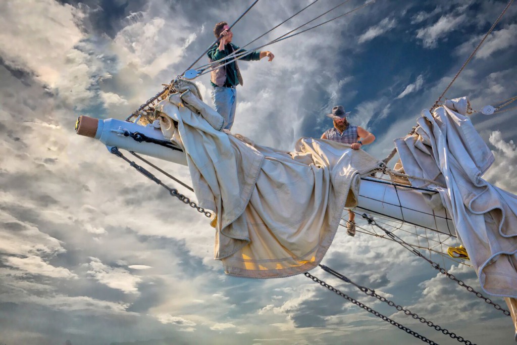 Crew handling sails aboard the Victory Chimes